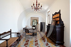 Long dining room in apartment interior in old country house