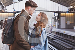 Long distance relationship, couple at the train station