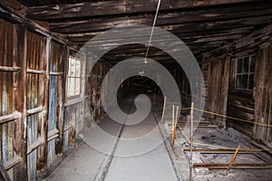 Long dust hallway in wooden shelter