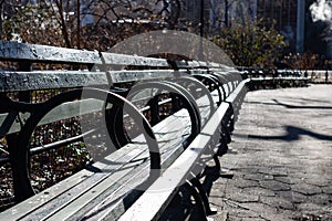 Long Empty Green Bench at Stuyvesant Square Park in New York City