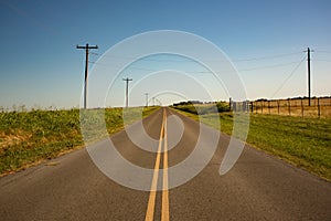 Long Empty Rural Road Through Farmland in Oklahoma