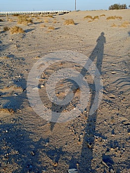 Long Evening Shadow in the Desert, Walking Woman