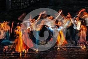 Long exposed and colorful photo of the ballerinas and ballets performing their art in a musical.