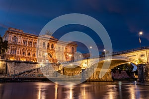 Long Exposition of the Building of the Court of Cassation and a Bridge of the Tevere River Illuminated by Lights at the Blue Hour