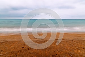 Long exposure abstract seascape on the beach