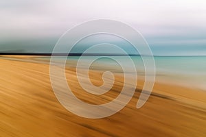 Long exposure abstract seascape on the beach