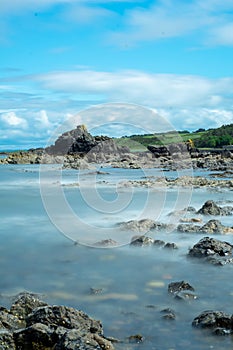 Long exposure beach shot. Water becomes glass. photo