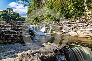 A long exposure close up view of the upper falls at Stainforth Force, Yorkshire