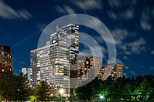 Long exposure of clouds moving across a dark blue sky over modern residential highrise buildings in the Lakeview neighborhood photo