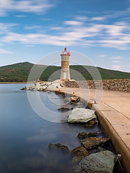 Long exposure day photo of Lighthouse in Macinaggio marina Corsica, France, Europe photo