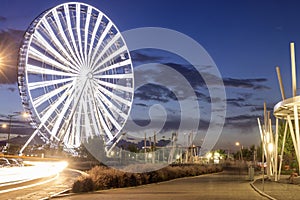 Long exposure of a Ferris wheel at dusk photo