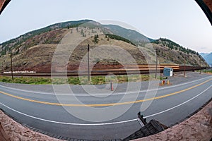 Long exposure with a fisheye view of a passing train in Spences Bridge, British Columbia, Canada