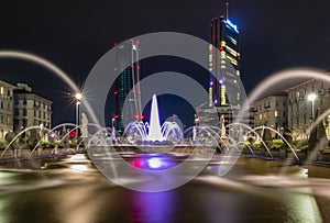 A long exposure if the Four seasons fountain in Milan and the two giants by night