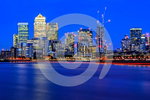 Long exposure, illuminated cityscape in Canary Wharf, London