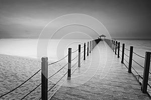 Long exposure image of old abandoned fisherman jetty in black an