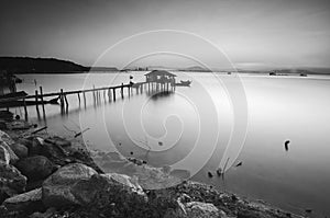 Long exposure image of old abandoned fisherman jetty in black and white