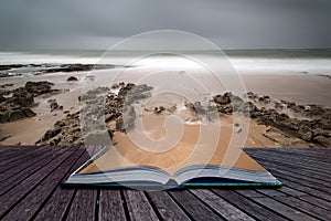 Long exposure landscape beach scene with moody sky conceptual bo