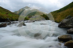 Long exposure landscape mountaiin river and georgian village Ushguli