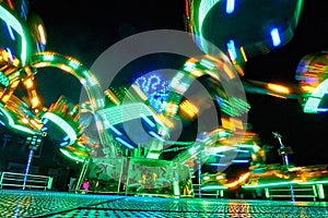 Long exposure of a moving fair attraction