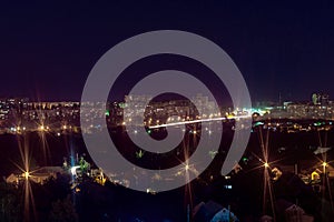 Long exposure night photo. A lot of lights symbolized Big city life at night. Blue and red lights. Night cityscape