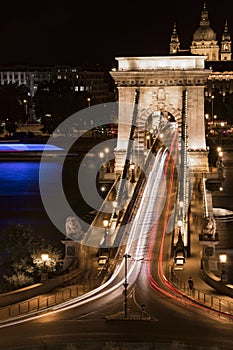 Long-exposure night shot of a bridge and traffic circle