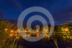 Night shot over the lake with bridge and stars