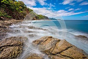 Long exposure, pacific ocean waves on rock in Playa Ocotal, El Coco Costa Rica