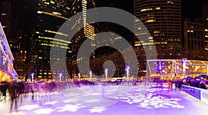 Long exposure panorama of ice skaters on the rink at the Bryant Park Holiday Village