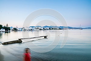 Long exposure of a person in red on the beach in Pollonia photo