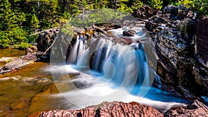 Long Exposure photo of the Redrock Falls in Glacier National Park photo