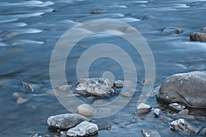 Long exposure photo of a smooth water surface on small mountain