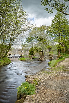 A long exposure photograph of the ancient pack horse bridge at Wycoller, Lancashire