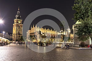 Long exposure photography of the Cloth Hall and Town Hall Tower in main square of the Old Town of Krakow, Poland