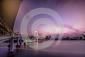 Long exposure photography of sunset on Rainbow Bridge and Tokyo