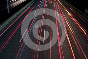 Traffic at night: Light Trails on a Motorway - abstract background