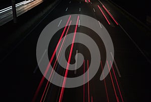 Traffic at night: Light Trails on a Motorway - abstract background