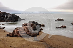 Long exposure of the sea hitting some rocks in Mansa beach, Uruguay