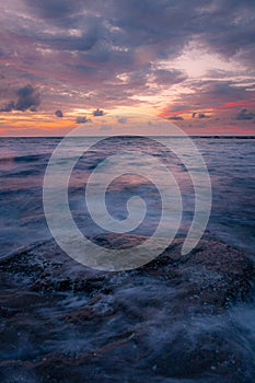 Long exposure sea and rocks at twilight