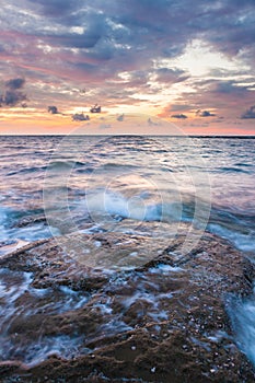 Long exposure sea and rocks at twilight