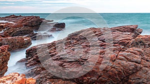 Long Exposure Of Sea With Smooth Wave And Rock. nature of Seascape