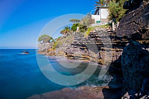 Long exposure seascape in a beautiful sunny day in summertime in ligurian coast of Genoa province, Italy