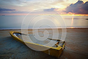 Long exposure shot of abandoned boat at seascape