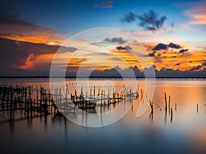 long exposure shot of a beautiful sunset at Songkhla Lake in Thailand