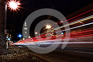 Long exposure shot of cars speeding with light trails at night