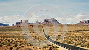 Long exposure shot of cars traveling along highway 163 at monument valley in utah