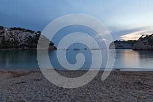 Long exposure shot evening shot of Cala Galdana bay in Menorca photo