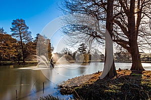 Long exposure shot of fountain and pavilion in Kew Gardens, London