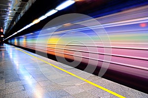 Long exposure shot of passing colorful trains