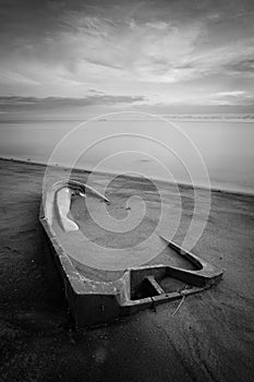 Long exposure shot of seascape at sunset in black and white