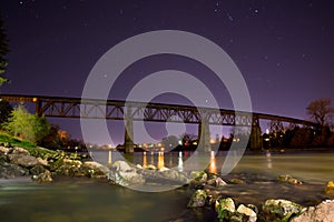 Night shot of train trestle over Sacramento River in Redding, CA